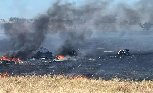 This photo provided by the Bell County Sheriff's Office shows the scene of an Army Apache helicopter crash Wednesday, Aug. 12, 2026, near Salado, Texas. (Cliff Coleman/Bell County Sherrif's Office via AP)
