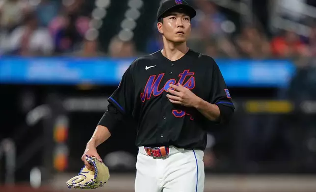 New York Mets pitcher Kodai Senga reacts as he leaves during the fifth inning of a baseball game against the Miami Marlins Friday, July 31, 2026, in New York. (AP Photo/Frank Franklin II)