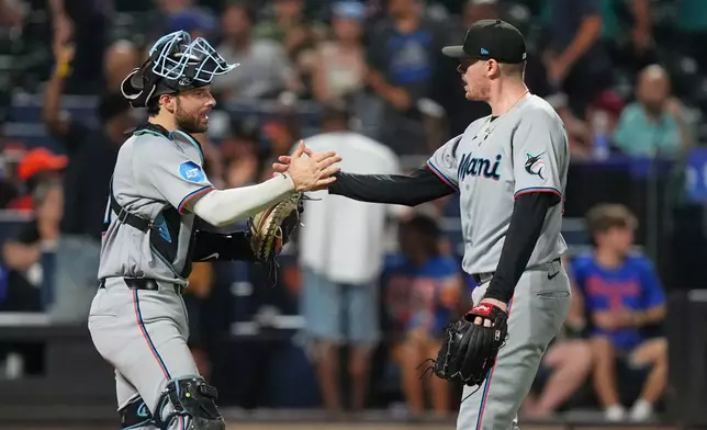 Miami Marlins pitcher Pete Fairbanks, right, celebrates with catcher Joe Mack after a baseball game against the New York Mets Friday, July 31, 2026, in New York. (AP Photo/Frank Franklin II)