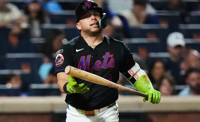 New York Mets' Francisco Alvarez reacts after striking out during the seventh inning of a baseball game against the Miami Marlins Friday, July 31, 2026, in New York. (AP Photo/Frank Franklin II)