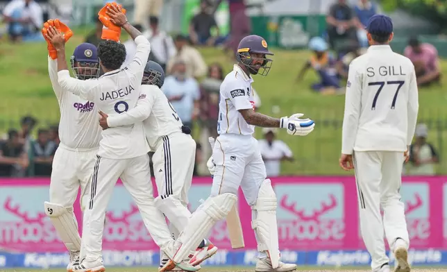 India's Ravindra Jadeja, second left, celebrates taking the wicket of Sri Lanka's Kamil Mishara with teammates during day four of the second cricket test match between Sri Lanka and India in Colombo, Sri Lanka, Wednesday, Aug. 26, 2026. (AP Photo/Eranga Jayawardena)