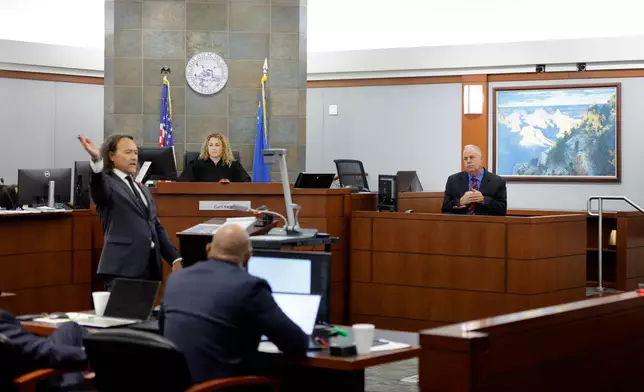 Michael Sanft, attorney for Duane Davis, left, asks a question to Garry Dale, a former Las Vegas Metro Police Department officer, during the Duane Davis murder trial, related to the 1996 killing of rapper Tupac Shakur, at Clark County District Court Regional Justice Center in Las Vegas,, Monday, Aug. 17, 2026. (Steve Marcus/Pool Photo via AP)