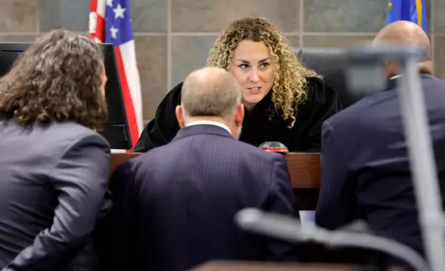 District Court Judge Carli Kierny confers with Michael Sanft, attorney for Duane Davis, left, and Chief Deputy District Attorneys Marc DiGiacomo, center, and Binu Palal, during the Duane Davis murder trial, related to the 1996 killing of rapper Tupac Shakur, at Clark County District Court Regional Justice Center in Las Vegas, Monday, Aug. 17, 2026. (Steve Marcus/Pool Photo via AP)