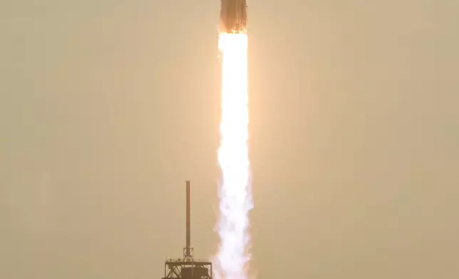 A SpaceX Falcon Heavy rocket with the space observatory Roman Telescope lifts off from launch complex 39A at the Kennedy Space Center in Cape Canaveral, Fla., Sunday, Aug. 30, 2026. (AP Photo/John Raoux)