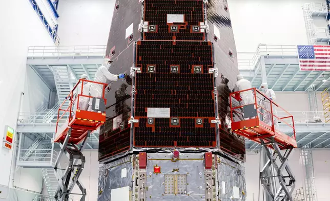 This photo provided by NASA shows technicians meticulously connecting the inner and outer segments of NASA's Nancy Grace Roman Space Telescope, Nov. 25, 2025 at NASA’s Goddard Space Flight Center in Greenbelt, Md. (Sydney Rohde/NASA via AP)