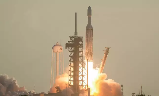 A SpaceX Falcon Heavy rocket with the space observatory Roman Telescope lifts off from launch complex 39A at the Kennedy Space Center in Cape Canaveral, Fla., Sunday, Aug. 30, 2026. (AP Photo/John Raoux)