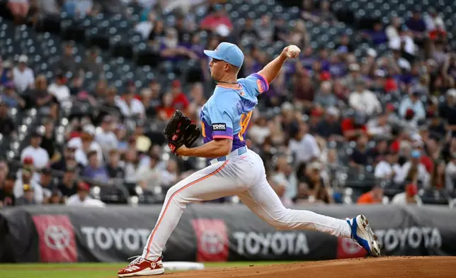 Colorado Rockies starting pitcher Tanner Gordon throws in the first inning of a baseball game against the Cleveland Guardians, Friday, Aug. 21, 2026, in Denver. (AP Photo/Geneva Heffernan)