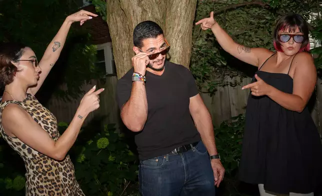 Abdul El-Sayed, a progressive candidate in the Democratic primary for U.S. Senate in Michigan, films a social media video at a pool party for content creators supporting his campaign, Monday, Aug. 3, 2026, in Detroit. (AP Photo/Julia Demaree Nikhinson)