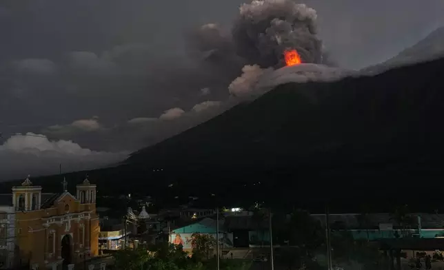 Lava flows and clouds of ash out of the crater of the Fuego Volcano, as seen from San Juan Alotenango, Guatemala, Tuesday, Aug. 4, 2026. (AP Photo/Moises Castillo)
