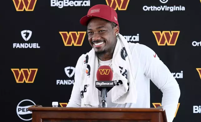 Washington Commanders wide receiver Stefon Diggs speaks to the media after practice at the team's NFL football training camp, Friday, Aug. 7, 2026 in Ashburn, Va. (AP Photo/Nick Wass)