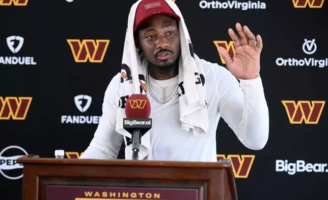 Washington Commanders wide receiver Stefon Diggs speaks to the media after practice at the team's NFL football training camp, Friday, Aug. 7, 2026 in Ashburn, Va. (AP Photo/Nick Wass)