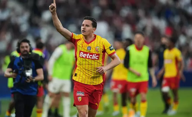 FILE - Lens' Florian Thauvin celebrates after scoring during the French Cup soccer final between Nice and Lens in Saint-Denis, outside Paris, Friday, May 22, 2026. (AP Photo/Thibault Camus, file)