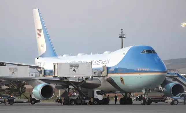 Catering trucks are parked at Air Force One on the tarmac as the motorcade carrying U.S. President Donald Trump arrives on the tarmac to depart following the NATO summit at Ankara International Airport in Ankara, Turkey, Wednesday, July 8, 2026. (AP Photo/Alex Brandon)