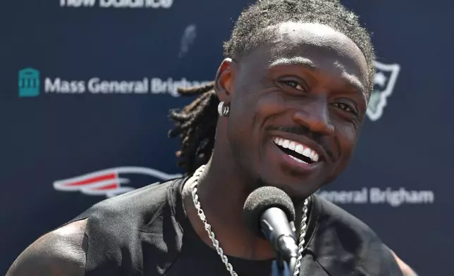 New England Patriots wide receiver A.J. Brown takes questions from reporters following a joint NFL football practice with the Philadelphia Eagles, Wednesday, Aug. 19, 2026, in Foxborough, Mass. (AP Photo/Steven Senne)