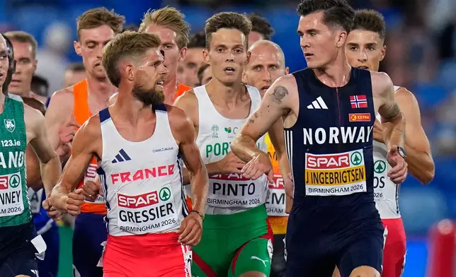 Norway's Jakob Ingebrigtsen gestures towards France's Jimmy Gressier as they race in the men's 5,000 meters final at the European Athletics Championships in Birmingham, England, Sunday, Aug. 9, 2026. (AP Photo/Petr David Josek)
