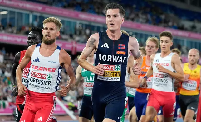 Norway's Jakob Ingebrigtsen and France's Jimmy Gressier compete in the men's 5,000 meters final at the European Athletics Championships in Birmingham, England, Monday, Aug. 10, 2026. (AP Photo/Matthias Schrader)