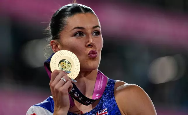 Britain's Amy Hunt celebrates after winning the gold medal in the women's 100 meters final at the European Athletics Championships in Birmingham, England, Monday, Aug. 10, 2026. (AP Photo/Petr David Josek)