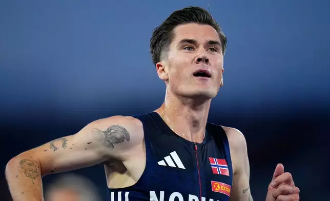 Norway's Jakob Ingebrigtsen celebrates after winning the gold medal in the men's 5,000 meters final at the European Athletics Championships in Birmingham, England, Sunday, Aug. 9, 2026. (AP Photo/Petr David Josek)