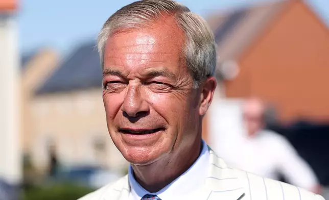 Britain's Reform UK party leader Nigel Farage arrives at a polling station in Walton on the Naze, Thursday, Aug. 13, 2026 to cast his vote for the Clacton on Sea by-election.(AP Photo/Richard Pelham)