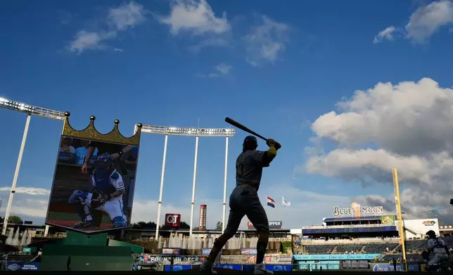Athletics' Henry Bolte warms up before a baseball game against the Kansas City Royals, Wednesday, Aug. 19, 2026, in Kansas City, Mo. (AP Photo/Charlie Riedel)