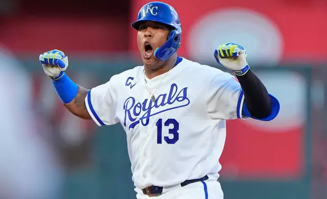 Kansas City Royals' Salvador Perez celebrates on second after hitting an RBI double during the fourth inning of a baseball game against the Athletics, Wednesday, Aug. 19, 2026, in Kansas City, Mo. (AP Photo/Charlie Riedel)