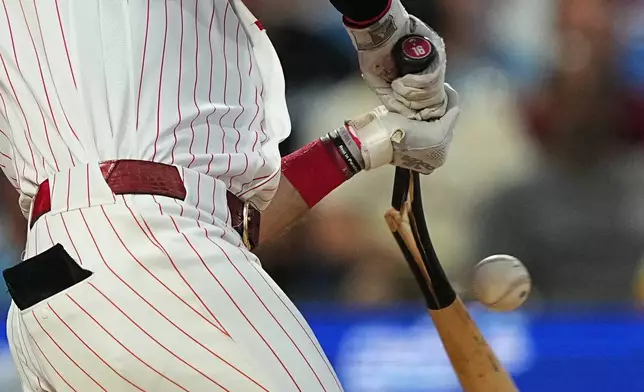 Philadelphia Phillies' Brandon Marsh brakes his bat while grounding out off a pitch by Miami Marlins pitcher Josh Ekness a during the fourth inning of a baseball game, Tuesday, Aug. 18, 2026, in Philadelphia. (AP Photo/Matt Rourke)