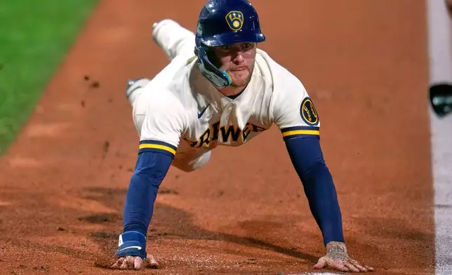 Milwaukee Brewers' Brice Turang scores on a double by Jake Bauers off Atlanta Braves pitcher Tyler Mahle during the third inning of the Little League Classic baseball game in Williamsport, Pa., Sunday, Aug. 23, 2026. (AP Photo/Gene J. Puskar)