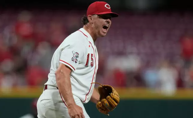 Cincinnati Reds pitcher Emilio Pagán reacts after striking out Athletics' Tommy White during the ninth inning to win a baseball game in Cincinnati, Wednesday, Aug. 5, 2026. (AP Photo/Carolyn Kaster)