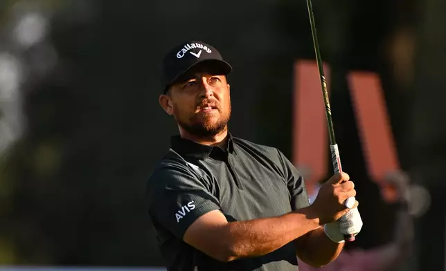 Xander Schauffele watches his shot from the 11th tee during the first round of the Rocket Classic golf tournament at the Detroit Golf Club, Thursday, July 30, 2026, in Detroit. (AP Photo/Jose Juarez)