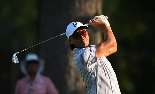 Rickie Fowler hits from the 11th tee during the first round of the Rocket Classic golf tournament at the Detroit Golf Club, Thursday, July 30, 2026, in Detroit. (AP Photo/Jose Juarez)