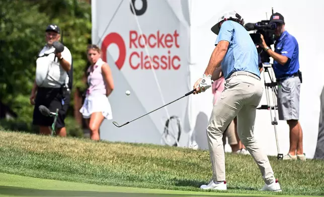 Cameron Young chips onto the eighth green during the first round of the Rocket Classic golf tournament at the Detroit Golf Club, Thursday, July 30, 2026, in Detroit. (AP Photo/Jose Juarez)