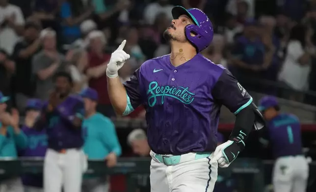 Arizona Diamondbacks' Nolan Arenado celebrates after hitting a solo home run against the Los Angeles Dodgers in the second inning of a baseball game, Friday, Aug 7, 2026, in Phoenix. (AP Photo/Rick Scuteri)