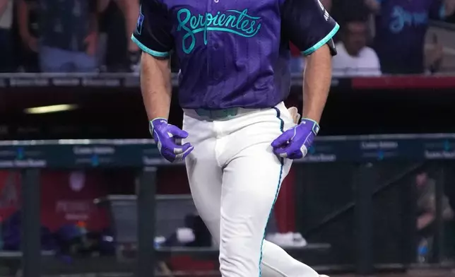 Arizona Diamondbacks' Ryan Waldschmidt reacts after hitting a two-run walk off home run against the Los Angeles Dodgers during a baseball game, Friday, Aug 7, 2026, in Phoenix. (AP Photo/Rick Scuteri)