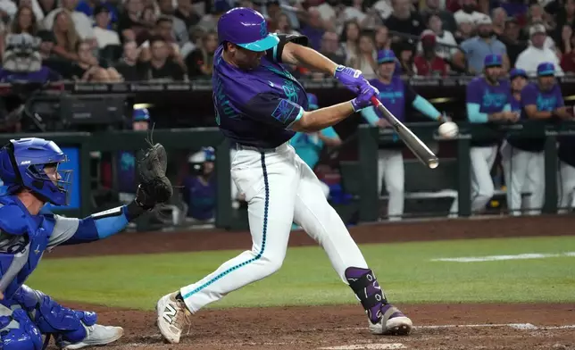 Arizona Diamondbacks' Ryan Waldschmidt hits a two-run walk off home run against the Los Angeles Dodgers during a baseball game, Friday, Aug 7, 2026, in Phoenix. (AP Photo/Rick Scuteri)
