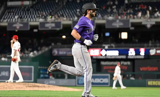 Colorado Rockies' Connor Norby runs to home plate after hitting a grand slam during the seventh inning of a baseball game against the Washington Nationals, Wednesday, Aug. 26, 2026, in Washington. (AP Photo/John McDonnell)