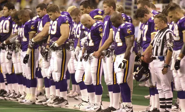 FILE - Minnesota Vikings players stand during a moment of silence for teammate Korey Stringer prior to their preseason game against the New Orleans Saints in San Antonio, Aug. 11, 2001. (AP Photo/Eric Gay, File)