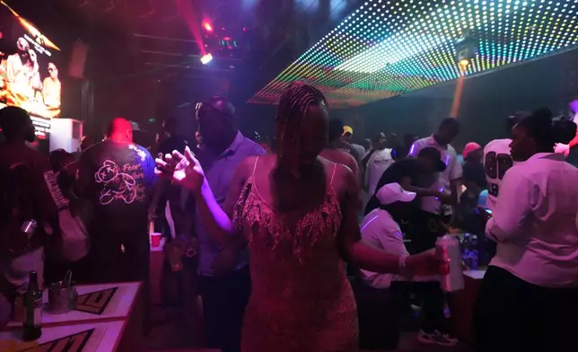 A partygoer dances to Afrobeats inside a nightclub in Sokoto, Nigeria, July 18, 2026. (AP Photo/Sunday Alamba)