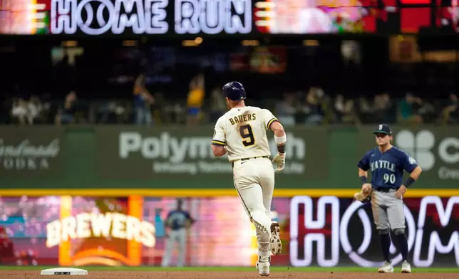 Milwaukee Brewers' Jake Bauers rounds the bases after hitting a two-run home run during the sixth inning of a baseball game against the Seattle Mariners, Tuesday, Aug. 18, 2026, in Milwaukee. (AP Photo/Aaron Gash)
