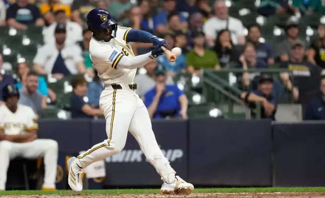 Milwaukee Brewers' Luis Lara hits a three-run home run for his first career home run during the eighth inning of a baseball game against the Seattle Mariners, Tuesday, Aug. 18, 2026, in Milwaukee. (AP Photo/Aaron Gash)