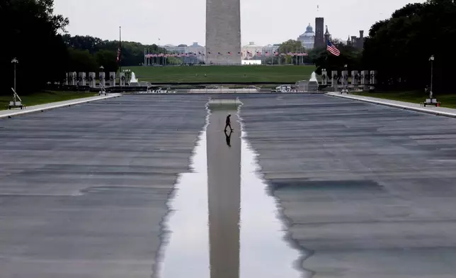 The Washington Monument is seen in the background of the now drained Lincoln Memorial Reflecting Pool, Wednesday, July 29, 2026, in Washington. (AP Photo/Rahmat Gul)