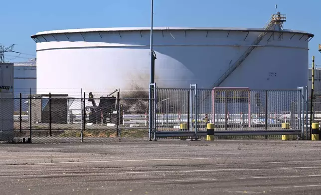A structure in a refinery and fuel terminal run by Gunvor Energy carries the traces of an explosion at the Dutch port of Rotterdam which killed at least one person and injured several others according to police, in Rotterdam, Netherlands, Thursday, Aug. 13, 2026. (AP Photo/Mouneb Taim)