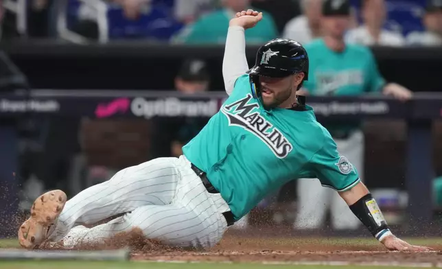 Miami Marlins' Joe Mack scores on a single hit by Javier Sanoja during the fifth inning of a baseball game against the Los Angeles Angels, Sunday, Aug. 9, 2026, in Miami. (AP Photo/Lynne Sladky)