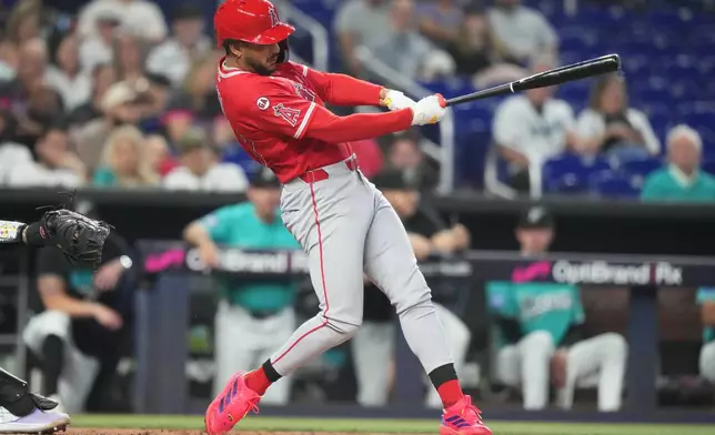 Los Angeles Angels' Jose Siri hits a solo home run during the second inning of a baseball game against the Miami Marlins, Sunday, Aug. 9, 2026, in Miami. (AP Photo/Lynne Sladky)