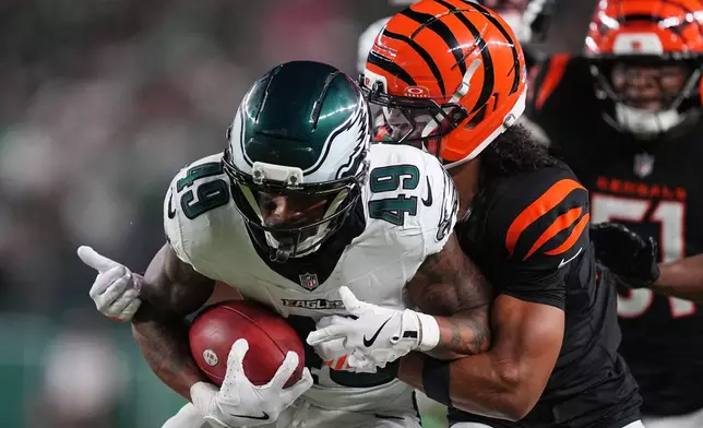 Philadelphia Eagles' Erik Ezukanma tries to get past Cincinnati Bengals defensive back Bralyn Lux (21) during the first half of a preseason NFL football game Friday, Aug. 28, 2026, in Philadelphia. (AP Photo/Matt Rourke)