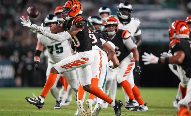 Cincinnati Bengals defensive back Tacario Davis intercepts a pass thrown by Philadelphia Eagles quarterback Tanner McKee intended for Eagles' Makai Lemon during the first half of a preseason NFL football game Friday, Aug. 28, 2026, in Philadelphia. (AP Photo/Matt Rourke)