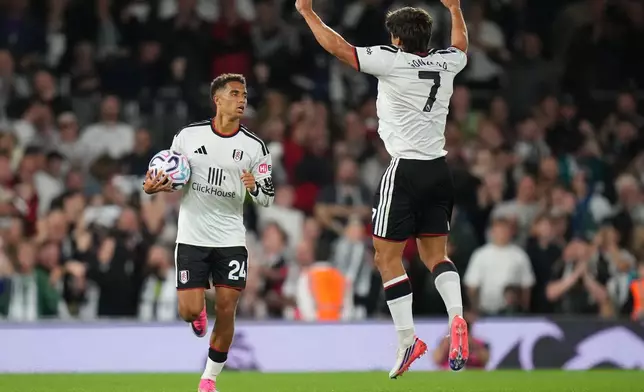 Fulham's Josh King and Gonzalo Garcia celebrate after scoring during the English Premier League soccer match between Fulham and Chelsea in London, Monday, Aug. 24, 2026. (AP Photo/Kirsty Wigglesworth)