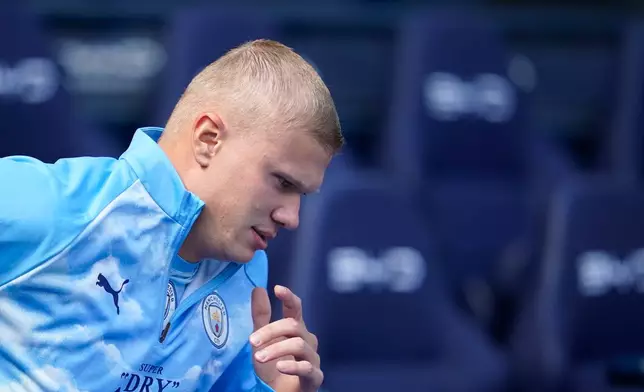 Manchester City's Erling Haaland warms up prior to the English Premier League soccer match between Manchester City and Bournemouth in Manchester, England, Sunday, Aug. 23, 2026. (AP Photo/Dave Thompson)