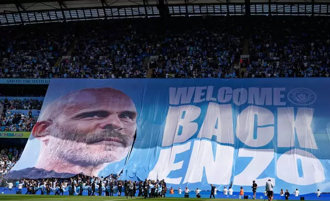 Manchester City fans display a tifo for Manchester City's head coach Enzo Maresca ahead of the English Premier League soccer match between Manchester City and Bournemouth in Manchester, England, Sunday, Aug. 23, 2026. (AP Photo/Dave Thompson)