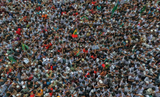 Rohingyas gather during an event at a refugee camp in Cox's Bazar, Bangladesh, Tuesday, Aug. 25, 2026, marking the anniversary of the their exodus. (AP Photo/Abdul Goni)