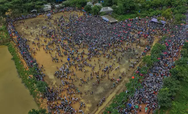 Rohingyas gather during an event at a refugee camp in Cox's Bazar, Bangladesh, Tuesday, Aug. 25, 2026, marking the anniversary of the their exodus. (AP Photo/Abdul Goni)